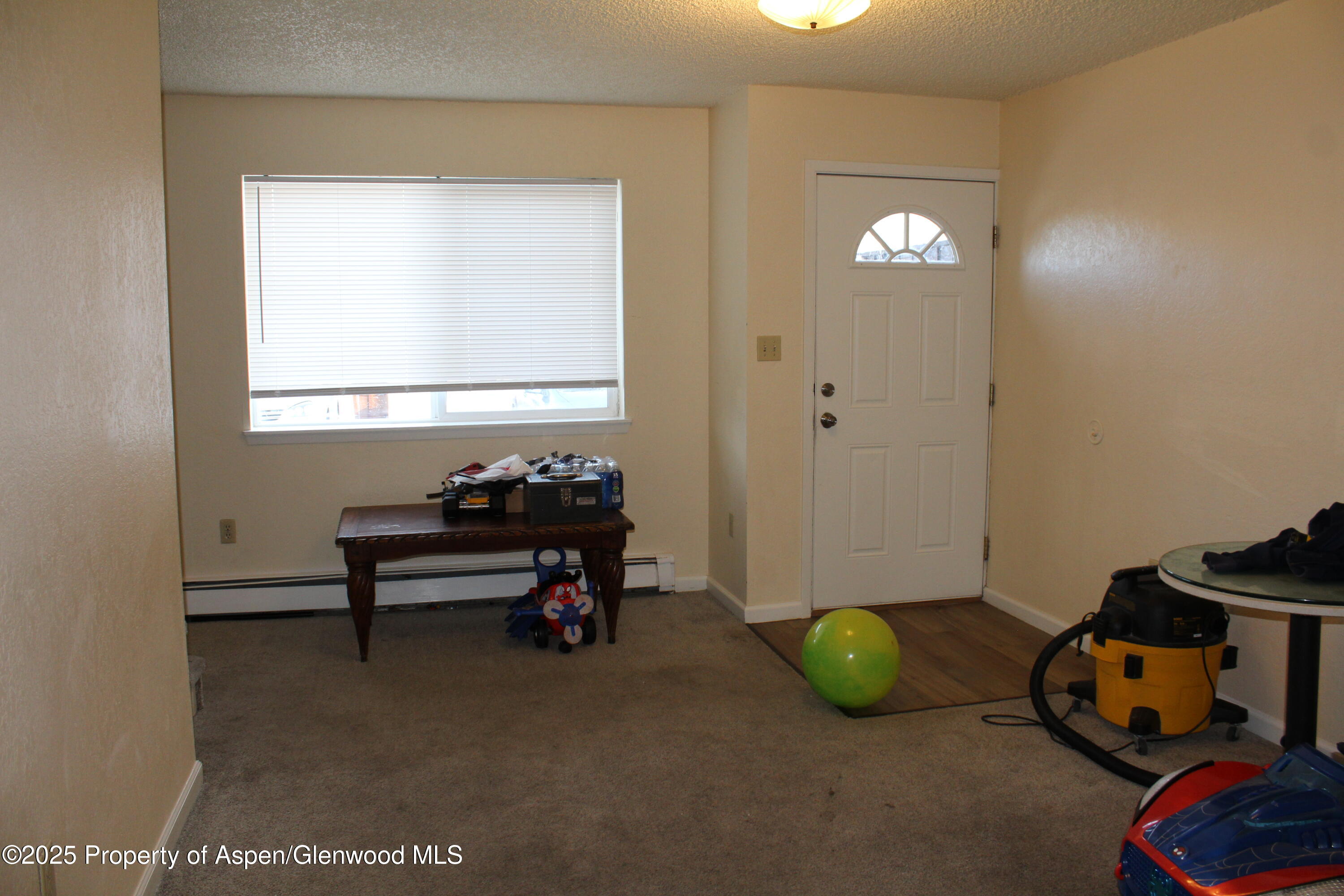 2404 West Avenue Rifle, CO 81650 - Photo 2 of 8 a bathroom with a sink and a mirror