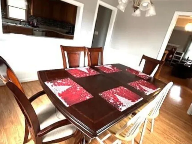 a view of a dining room with furniture and window