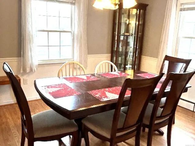 a closeup of a sink with granite countertop a view of living room