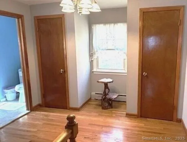 a bathroom with a sink vanity mirror and a bathtub