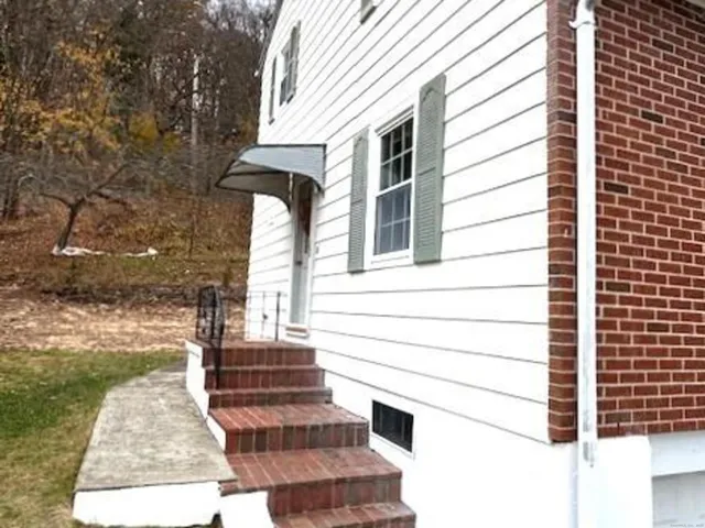 a view of a house with a small yard