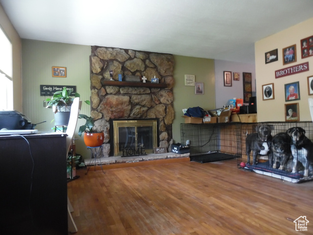 477 Grand Circle Moab, UT 84532 - Photo 4 of 22 Living area featuring wood finished floors and a stone fireplace