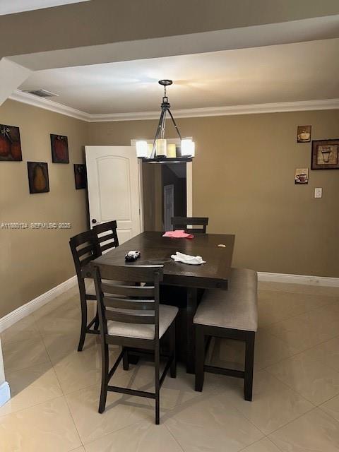 1619 Northwest 52nd Street, Unit 1 Miami, FL 33142 - Photo 7 of 16 a table and chairs in a room