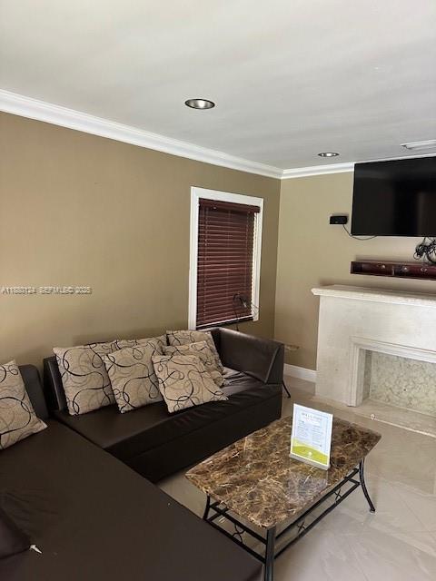 1619 Northwest 52nd Street, Unit 1 Miami, FL 33142 - Photo 8 of 16 a living room with a bed and a flat screen tv