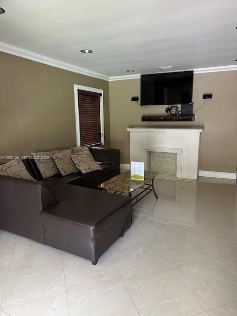 1619 Northwest 52nd Street, Unit 1 Miami, FL 33142 - Photo 9 of 16 a living room with furniture and a flat screen tv
