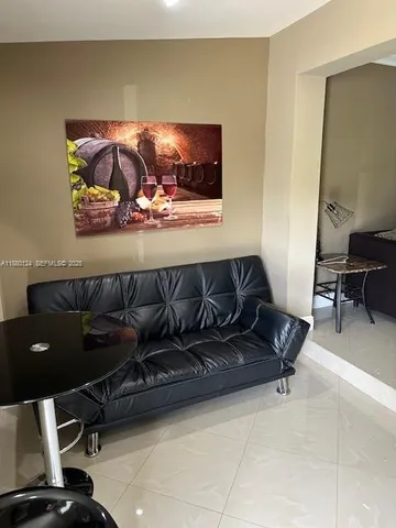 a living room with furniture and a couch