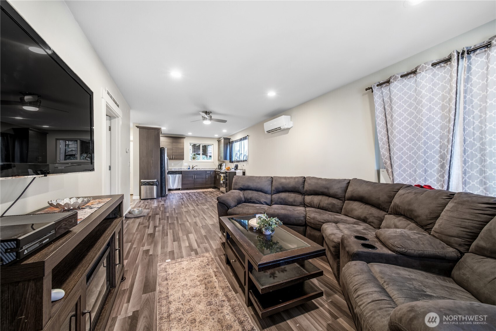 7516 Skinner Road Granite Falls, WA 98252 - Photo 24 of 40 a living room with furniture and a flat screen tv