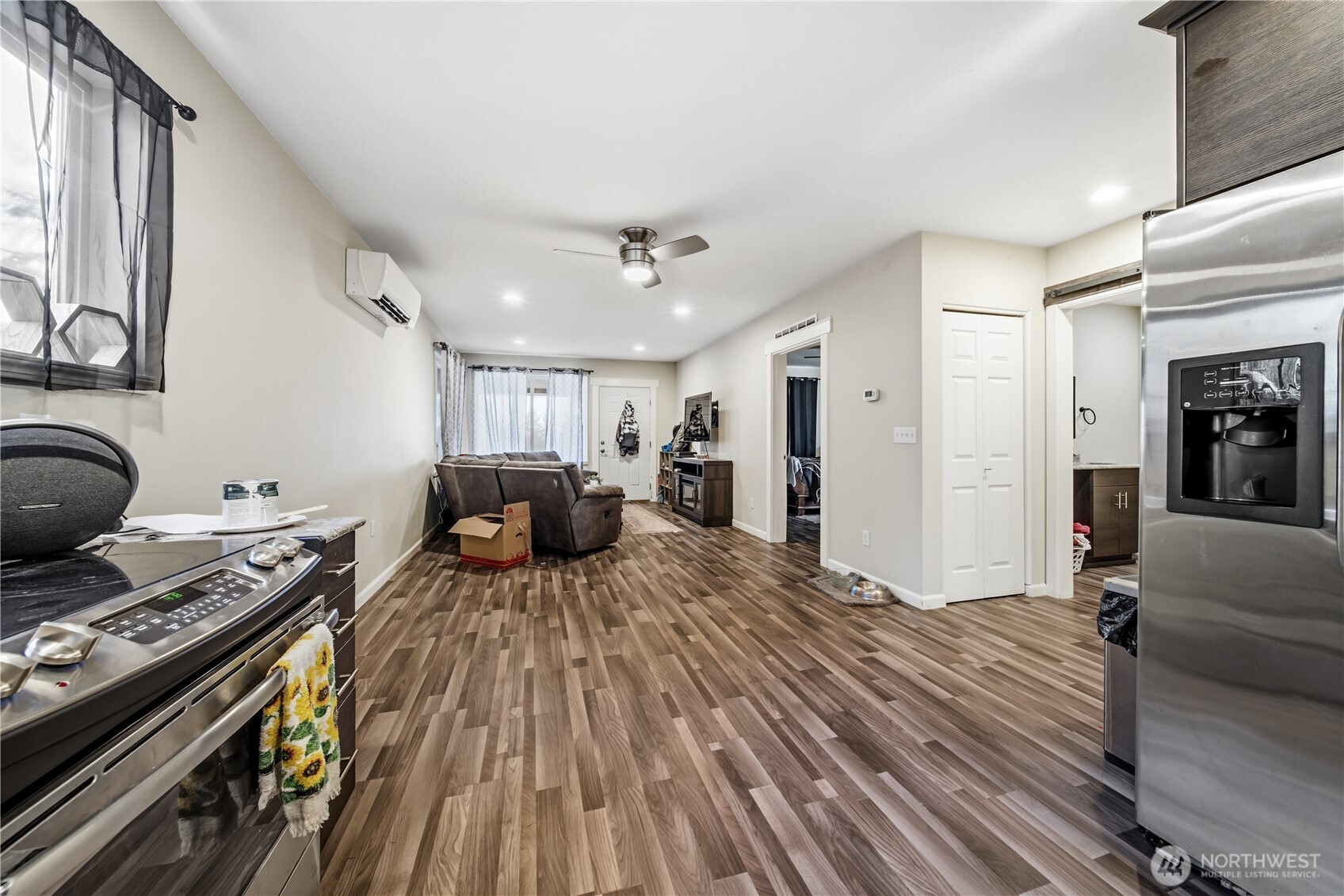 7516 Skinner Road Granite Falls, WA 98252 - Photo 25 of 40 a bed room with a bed furniture and a stove