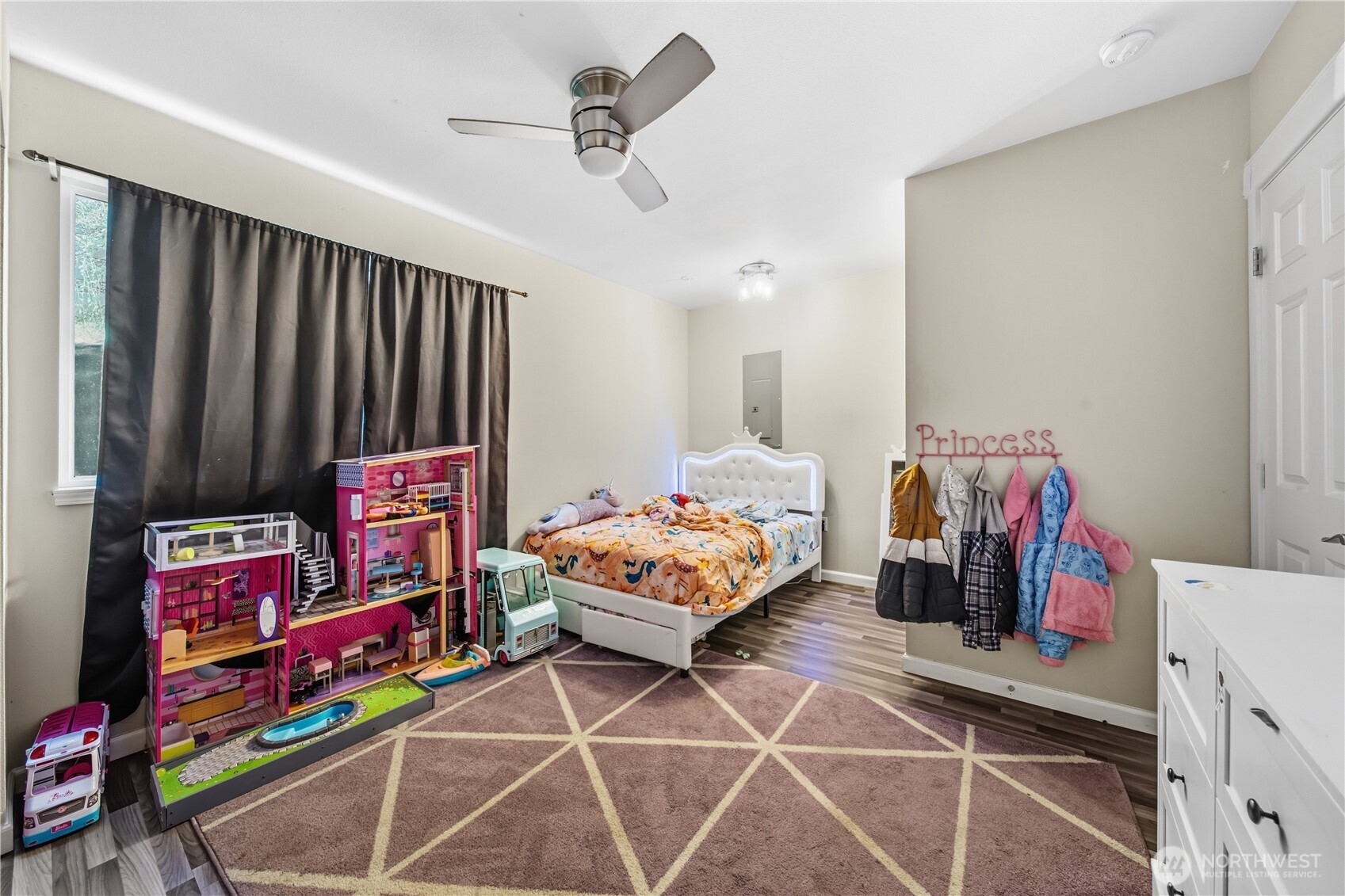 7516 Skinner Road Granite Falls, WA 98252 - Photo 27 of 40 a bedroom with bed and a chandelier