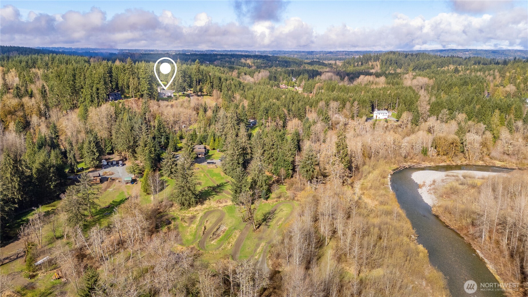 7516 Skinner Road Granite Falls, WA 98252 - Photo 38 of 40 a view of a lake view of a building with a yard