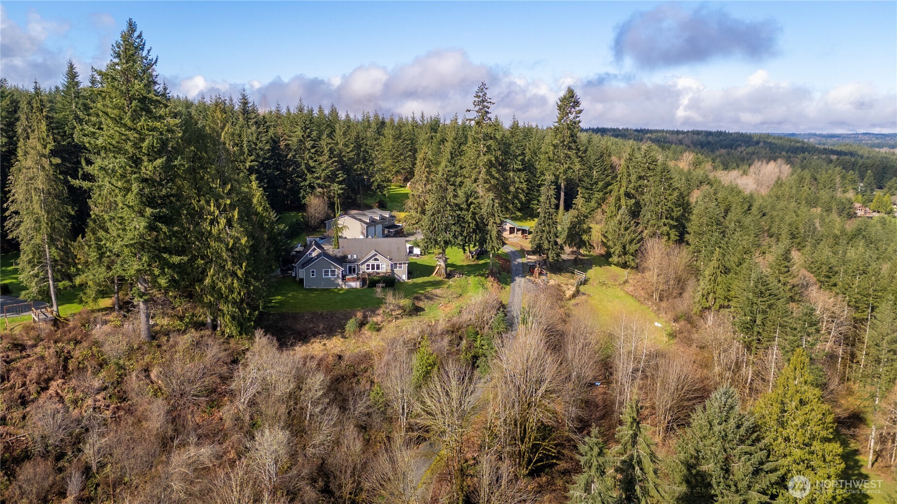 7516 Skinner Road Granite Falls, WA 98252 - Photo 39 of 40 a view of a lake in between two of trees