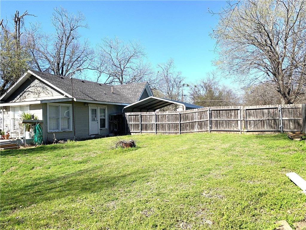 706 West Navasota Street Groesbeck, TX 76642 - Photo 18 of 18 a view of a house with a yard and sitting area