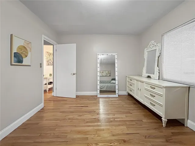 a view of a hallway with a bedroom