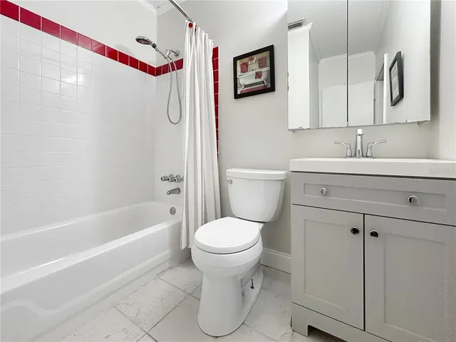 a bathroom with a toilet sink and shower