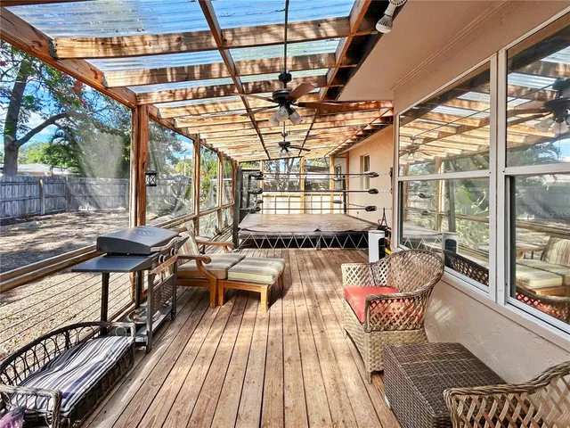 a view of a chairs and table on the balcony