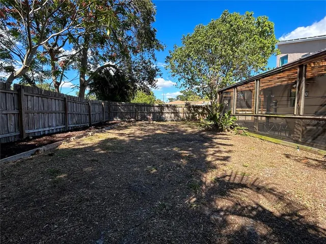 a view of a backyard of the house