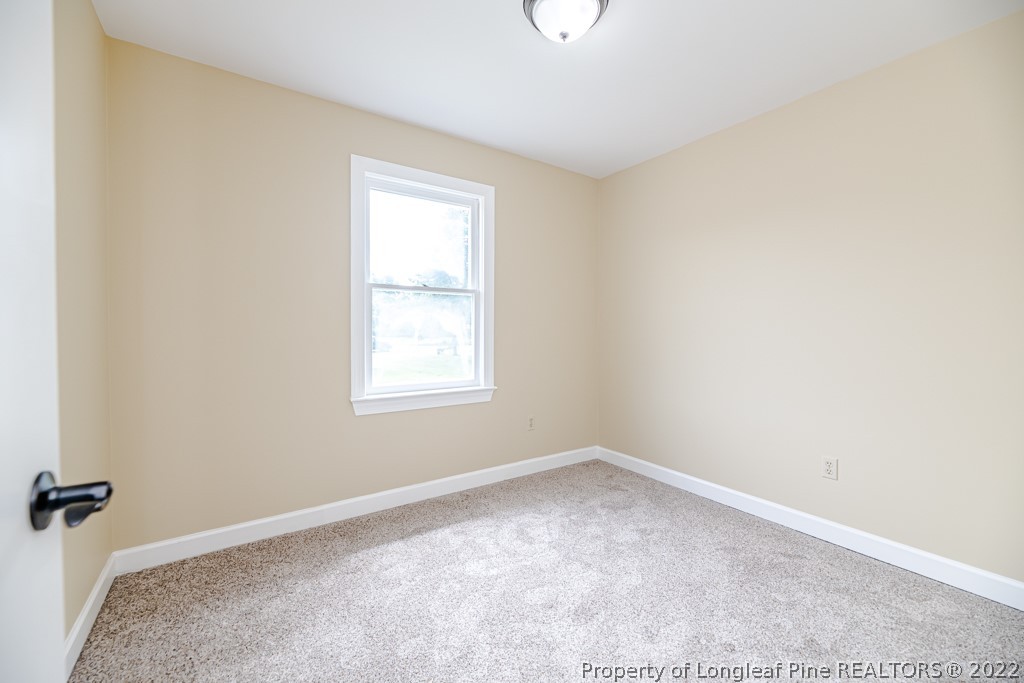 192 Cypress Road Cameron, NC 28326 - Photo 15 of 26 an empty room with a window