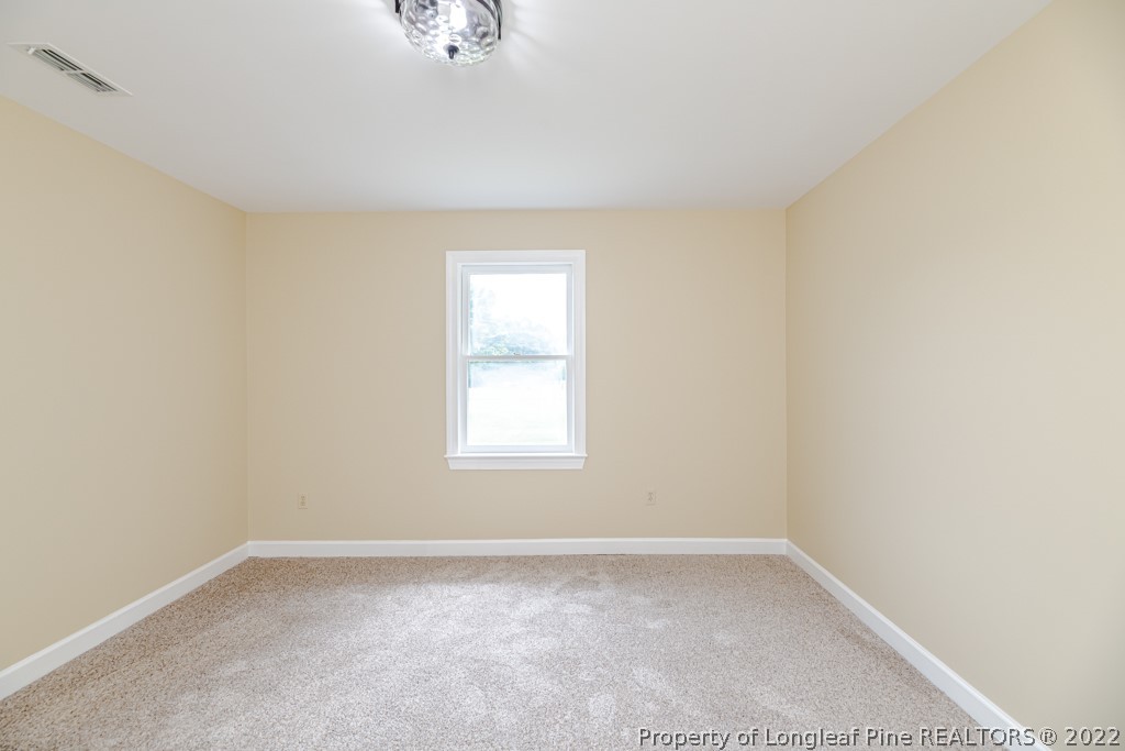 192 Cypress Road Cameron, NC 28326 - Photo 16 of 26 an empty room with a window
