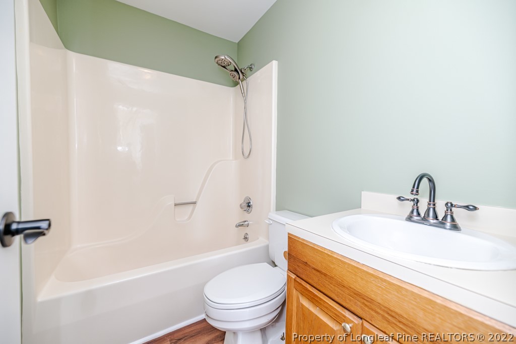 192 Cypress Road Cameron, NC 28326 - Photo 17 of 26 a bathroom with a sink toilet and shower