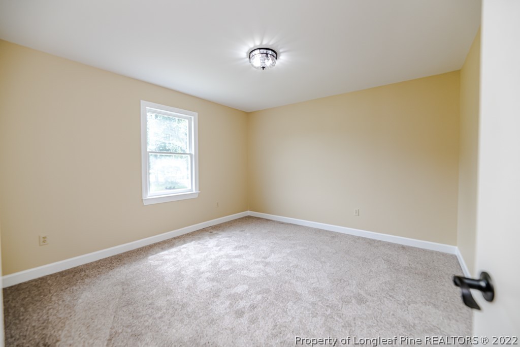 192 Cypress Road Cameron, NC 28326 - Photo 18 of 26 an empty room with a empty space and a window