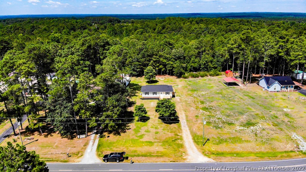 192 Cypress Road Cameron, NC 28326 - Photo 2 of 26 a view of a swimming pool with a patio