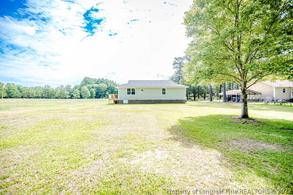 192 Cypress Road Cameron, NC 28326 - Photo 25 of 26 a view of yard with swimming pool and trees