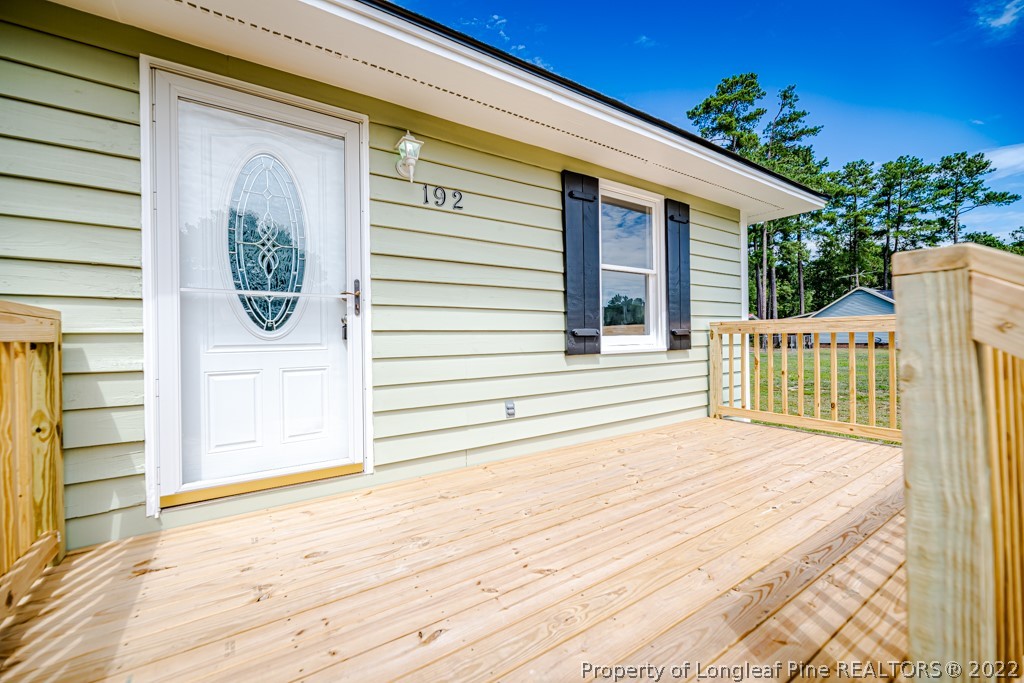 192 Cypress Road Cameron, NC 28326 - Photo 4 of 26 a front view of a house with a porch
