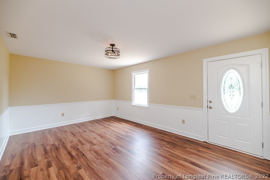 192 Cypress Road Cameron, NC 28326 - Photo 7 of 26 wooden floor in an empty room with a window