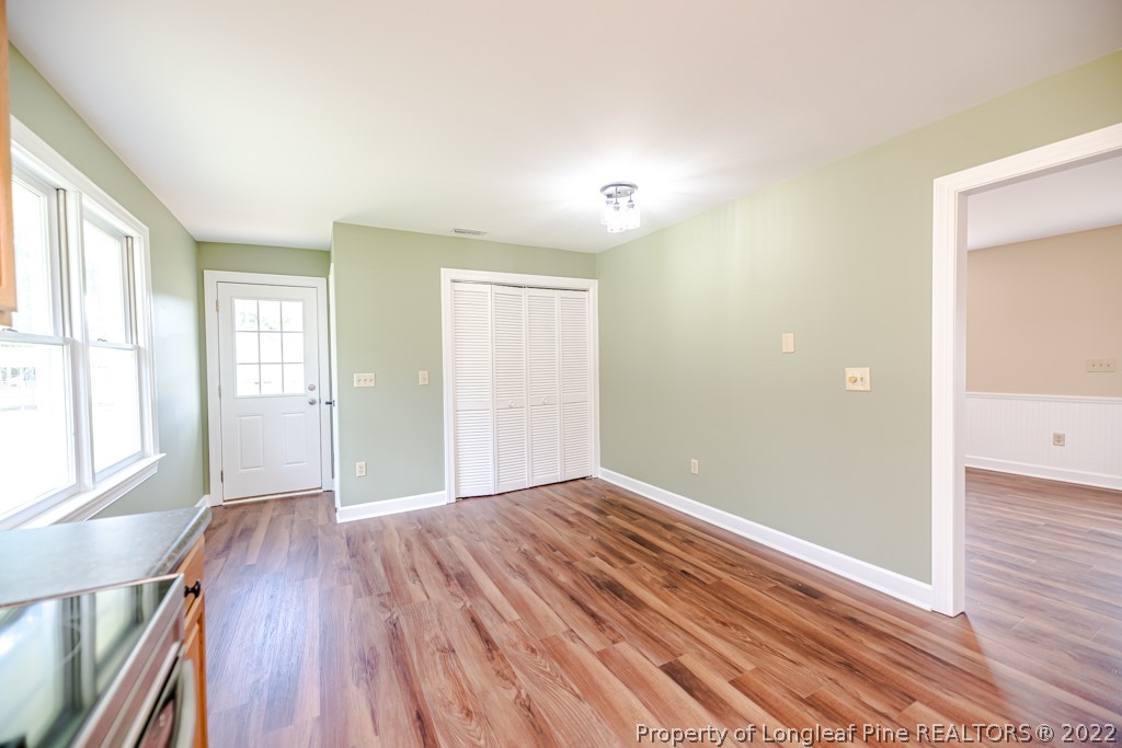 192 Cypress Road Cameron, NC 28326 - Photo 9 of 26 wooden floor in an empty room with a window