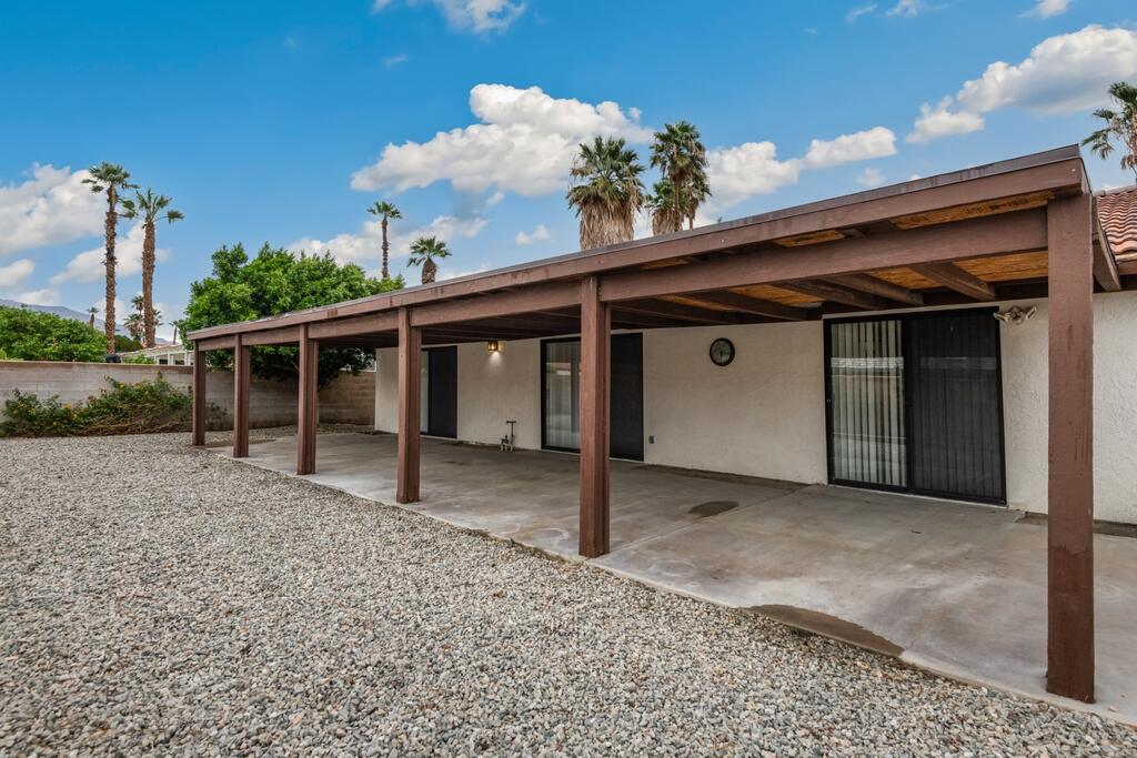 67425 Medano Road Cathedral City, CA 92234 - Photo 16 of 17 a view of a house with a backyard and balcony