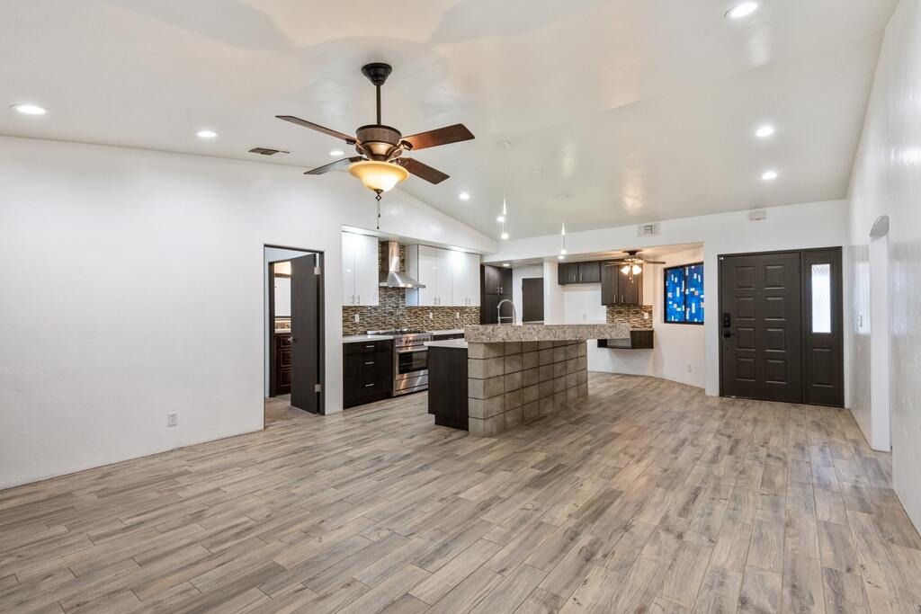 67425 Medano Road Cathedral City, CA 92234 - Photo 6 of 17 a kitchen with stainless steel appliances kitchen island wooden floors and center island