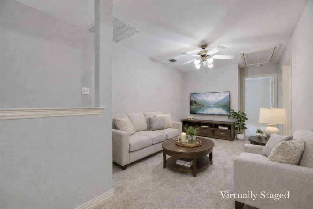 2320 Durango Ridge Drive Bedford, TX 76021 - Photo 11 of 21 a living room with furniture a rug and a window