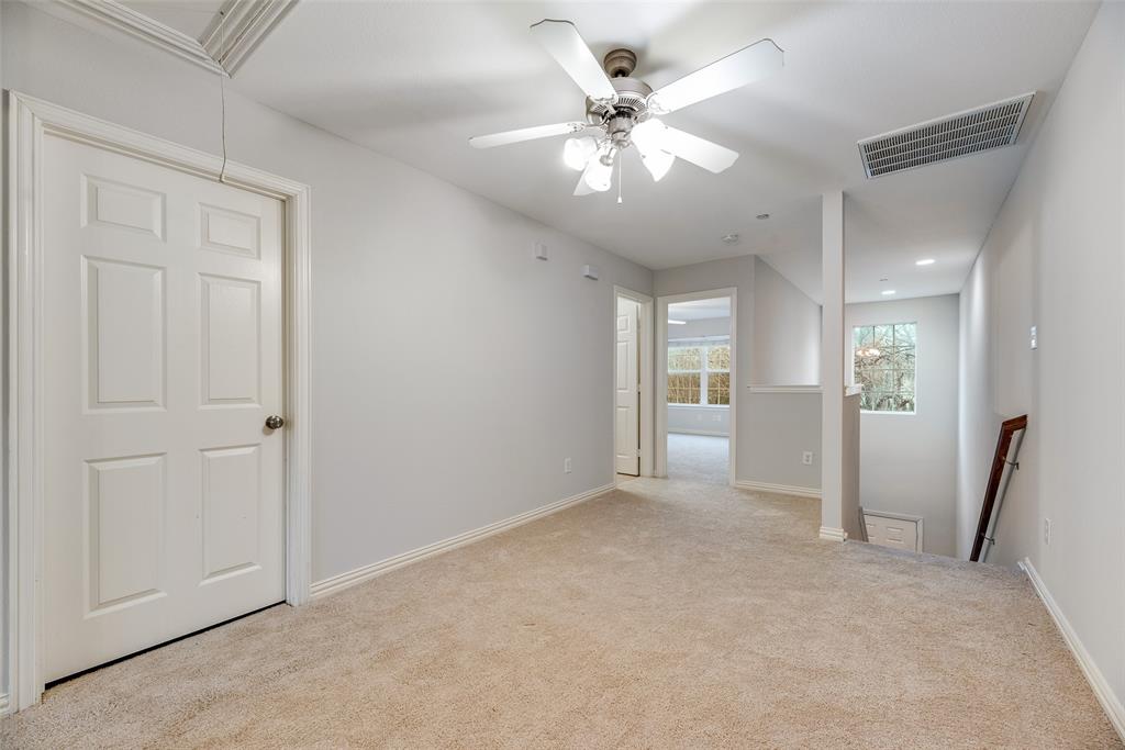 2320 Durango Ridge Drive Bedford, TX 76021 - Photo 9 of 21 an empty room with fan and hallway view