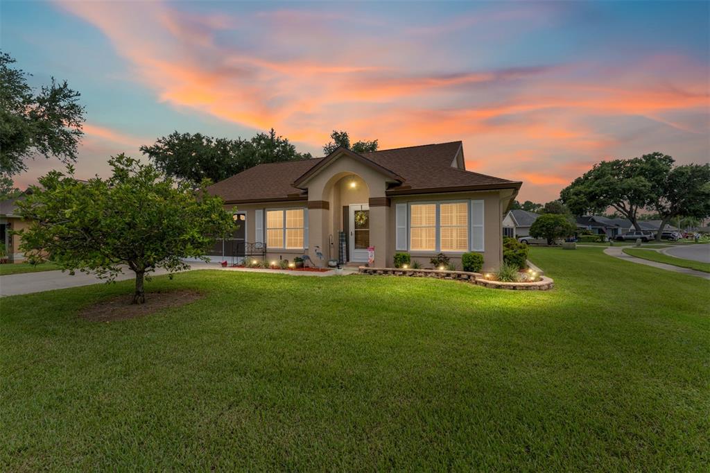 2121 Vindale Road Tavares, FL 32778 - Photo 1 of 37 a front view of a house with a yard