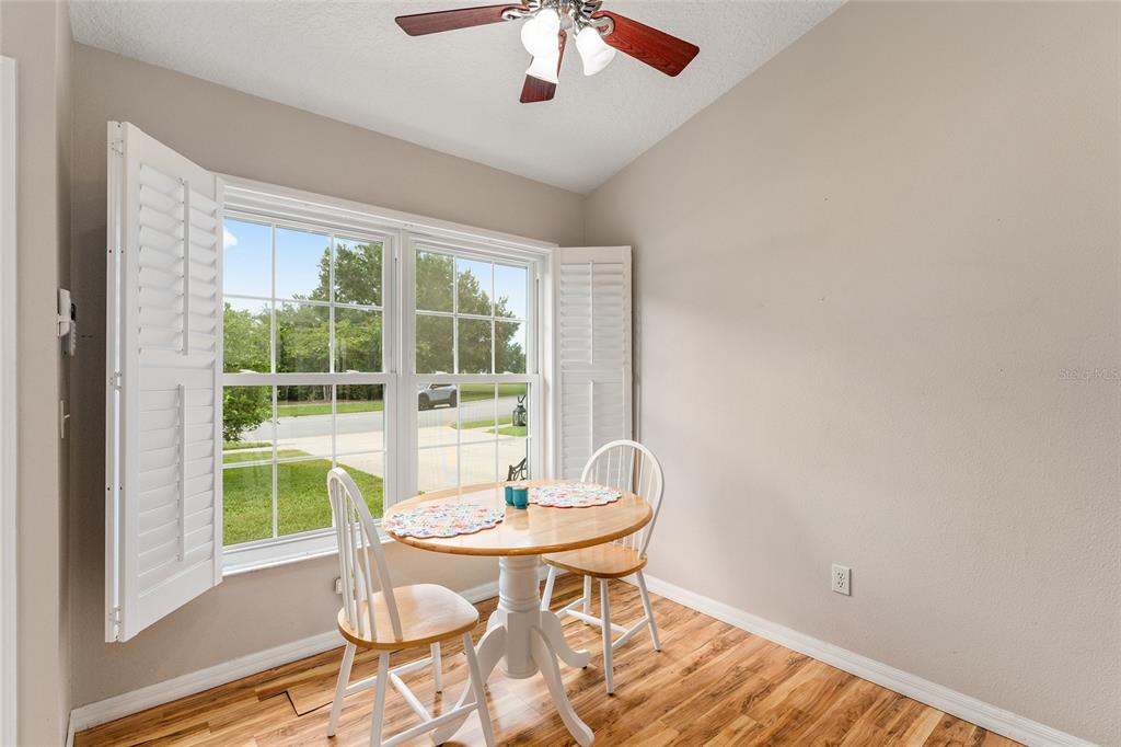 2121 Vindale Road Tavares, FL 32778 - Photo 12 of 37 a dining room with a table and chairs