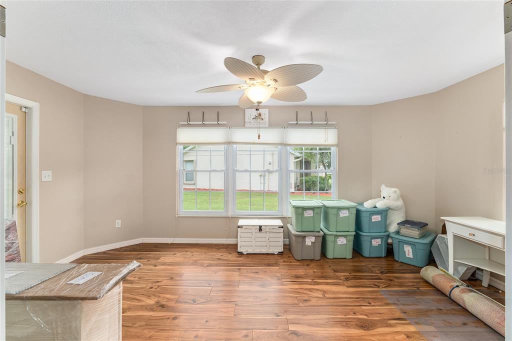 2121 Vindale Road Tavares, FL 32778 - Photo 17 of 37 a living room with a window