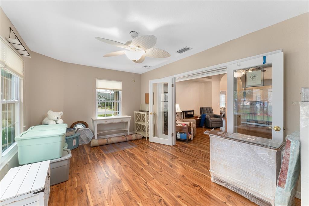 2121 Vindale Road Tavares, FL 32778 - Photo 19 of 37 a living room with furniture and a large window