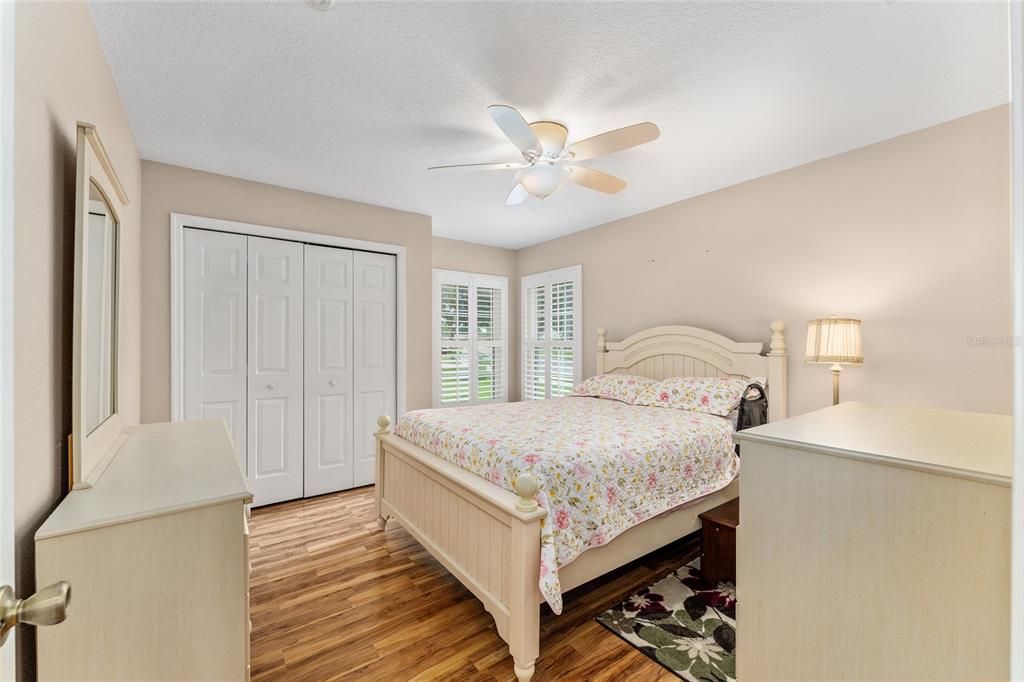 2121 Vindale Road Tavares, FL 32778 - Photo 30 of 37 a bedroom with a bed and a window