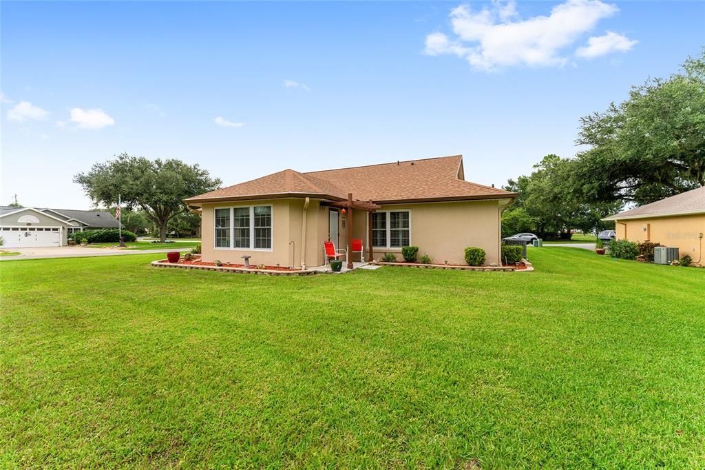 2121 Vindale Road Tavares, FL 32778 - Photo 32 of 37 a view of an house with backyard space and balcony
