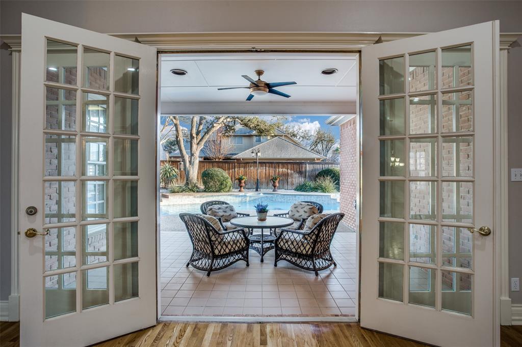 6509 Muirfield Road Fort Worth, TX 76132 - Photo 5 of 15 The French doors open to a little piece of paradise! A large coved patio and a sparkling patio, with a water feature, is perfect for any time of year.