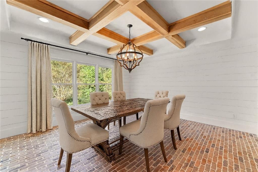 749 Hubert Pittman Road Pendergrass, GA 30567 - Photo 12 of 49 a view of a dining room with furniture window and wooden floor