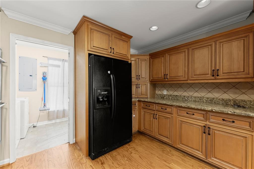 749 Hubert Pittman Road Pendergrass, GA 30567 - Photo 15 of 49 a kitchen with granite countertop a refrigerator and a sink