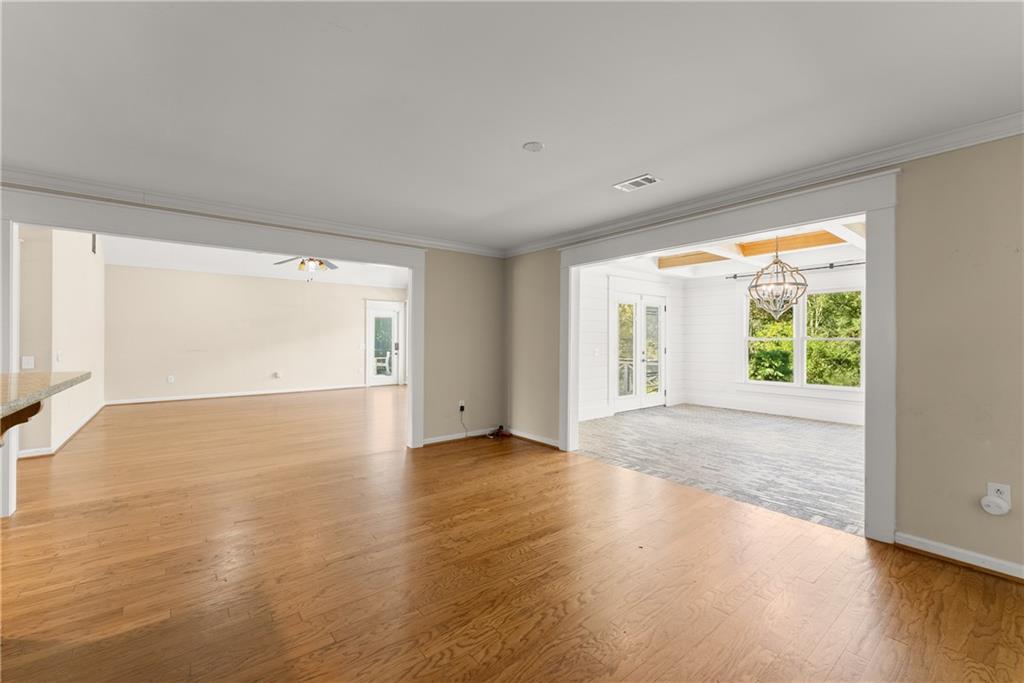 749 Hubert Pittman Road Pendergrass, GA 30567 - Photo 17 of 49 a view of an empty room with wooden floor and a window