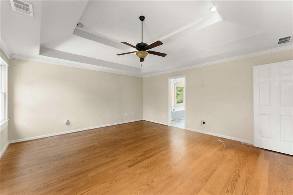 749 Hubert Pittman Road Pendergrass, GA 30567 - Photo 18 of 49 an empty room with fan and windows