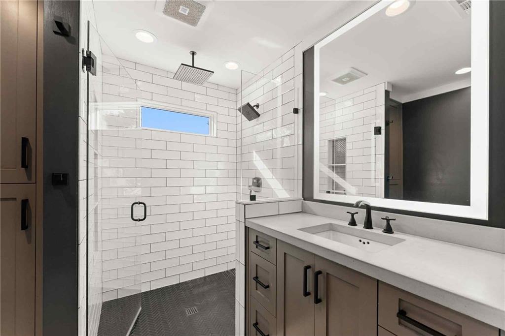 749 Hubert Pittman Road Pendergrass, GA 30567 - Photo 20 of 49 a bathroom with a sink shower and a mirror