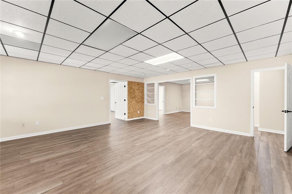749 Hubert Pittman Road Pendergrass, GA 30567 - Photo 29 of 49 a view of empty room with wooden floor and large window
