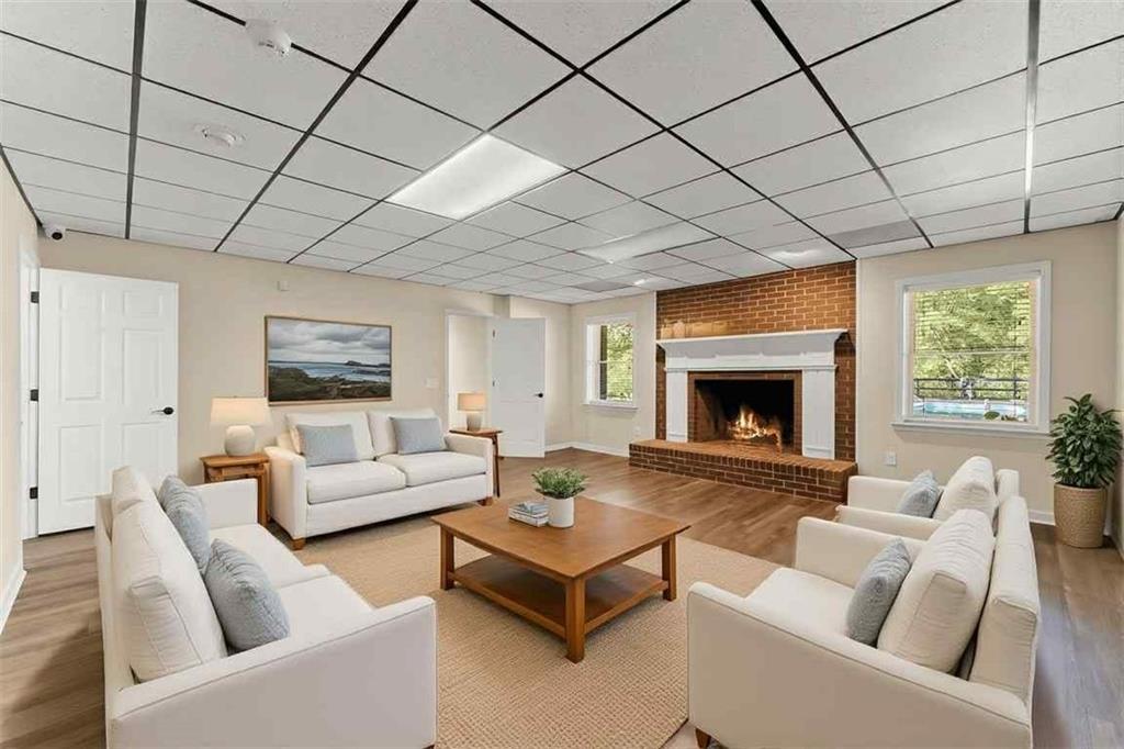 749 Hubert Pittman Road Pendergrass, GA 30567 - Photo 30 of 49 a living room with furniture and a fireplace