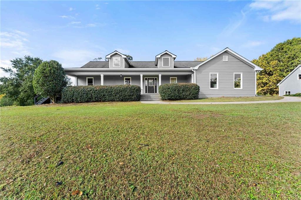 749 Hubert Pittman Road Pendergrass, GA 30567 - Photo 3 of 49 a front view of a house with yard and green space