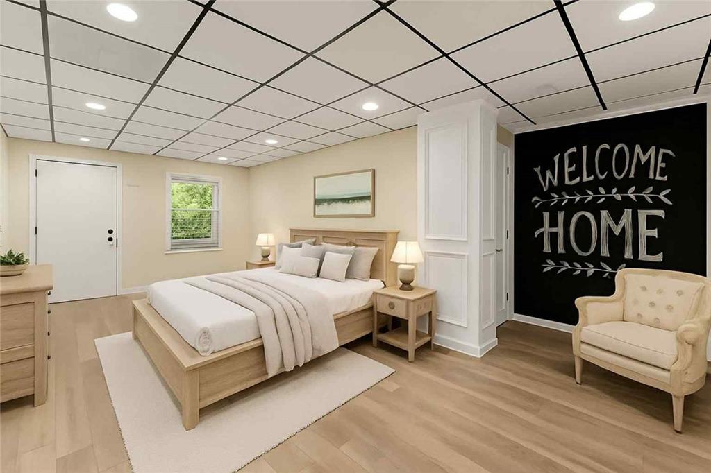 749 Hubert Pittman Road Pendergrass, GA 30567 - Photo 34 of 49 a spacious bedroom with a bed and a couch