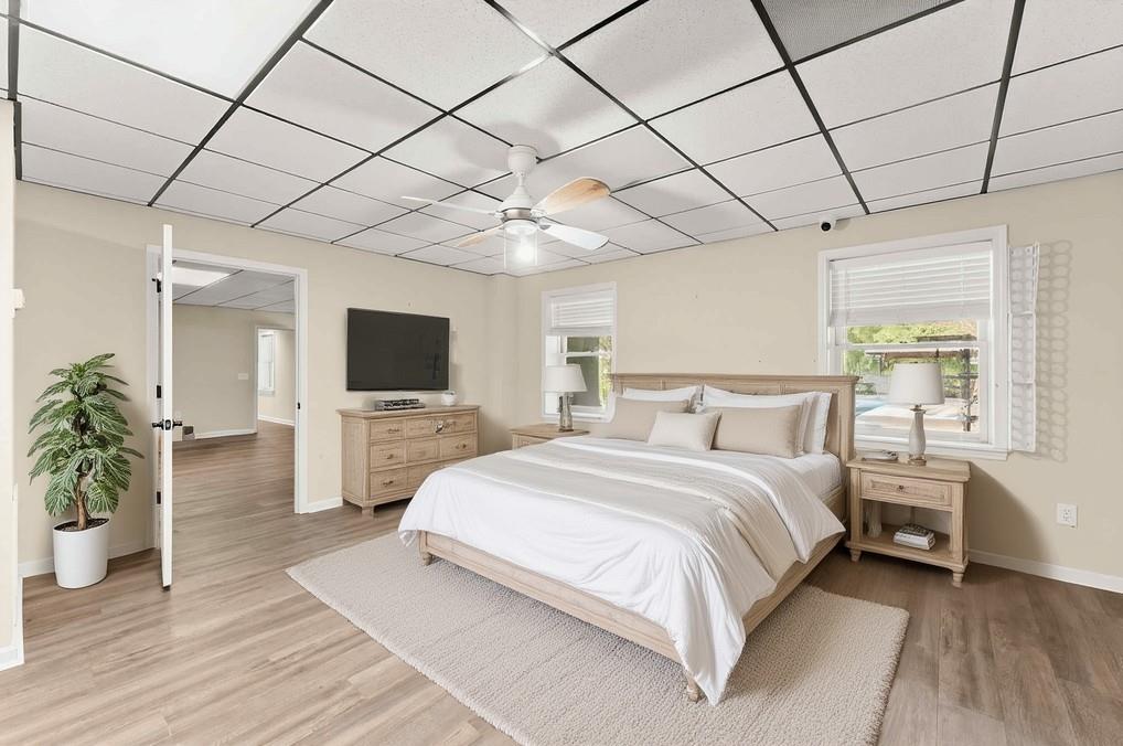 749 Hubert Pittman Road Pendergrass, GA 30567 - Photo 36 of 49 a spacious bedroom with a bed and a flat screen tv